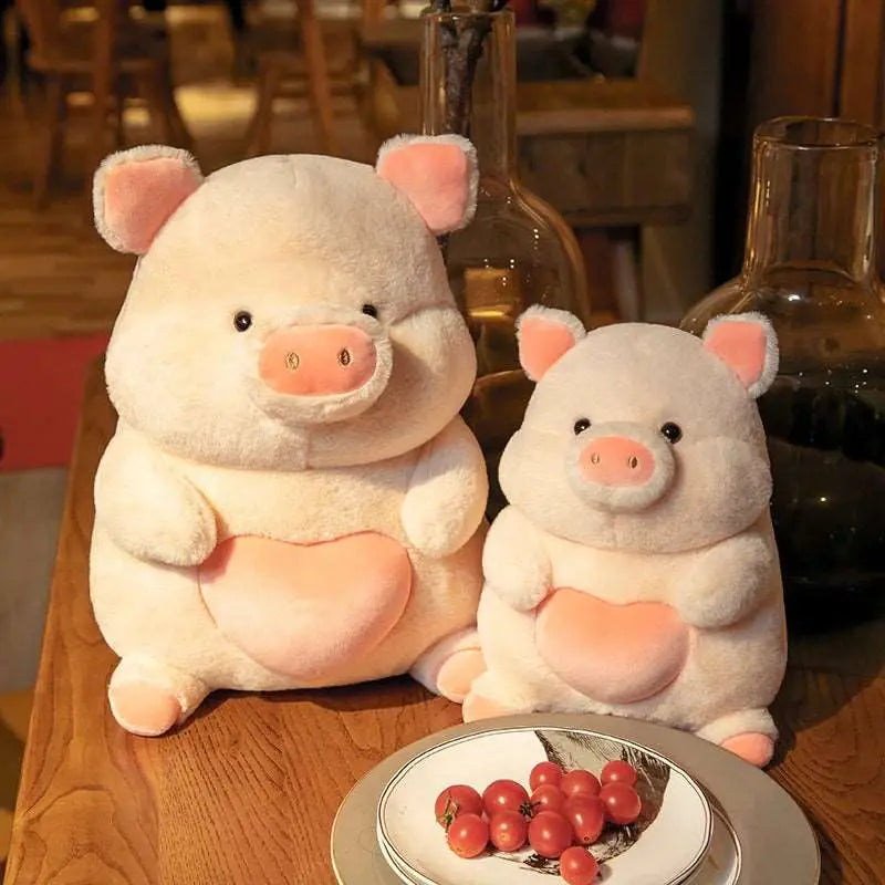 2 peluches cochons amoureux