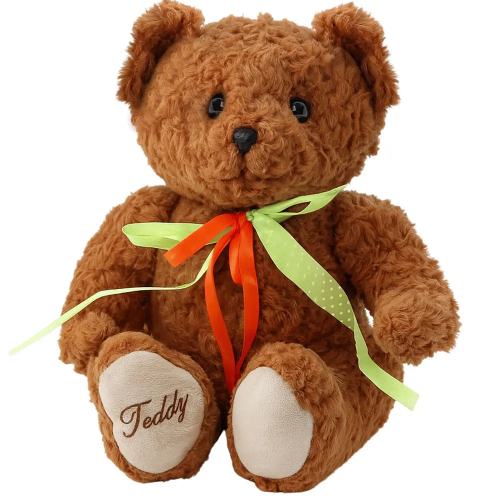 Ours en peluche marron avec nœud rouge et vert