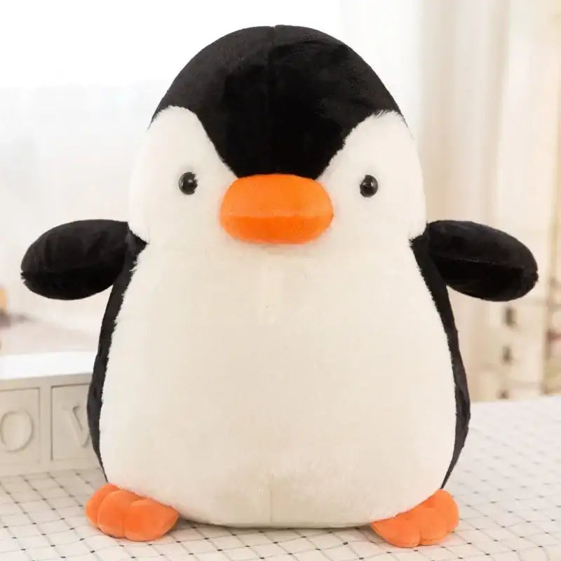 jolie petite peluche pingouin