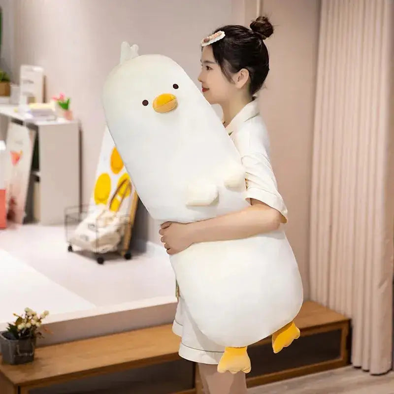 peluche canard coussin blanc