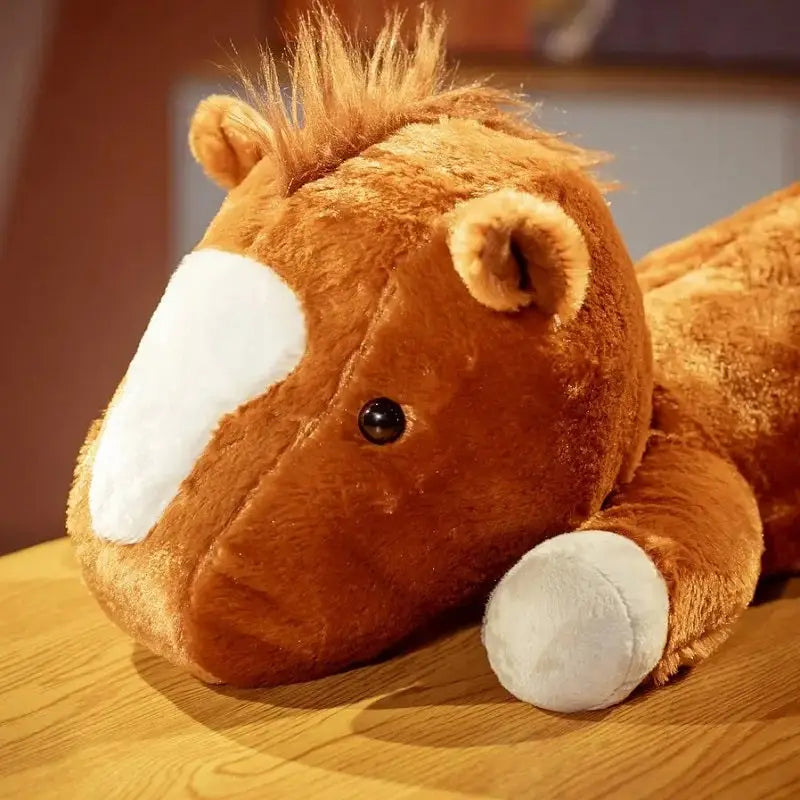 peluche cheval couché