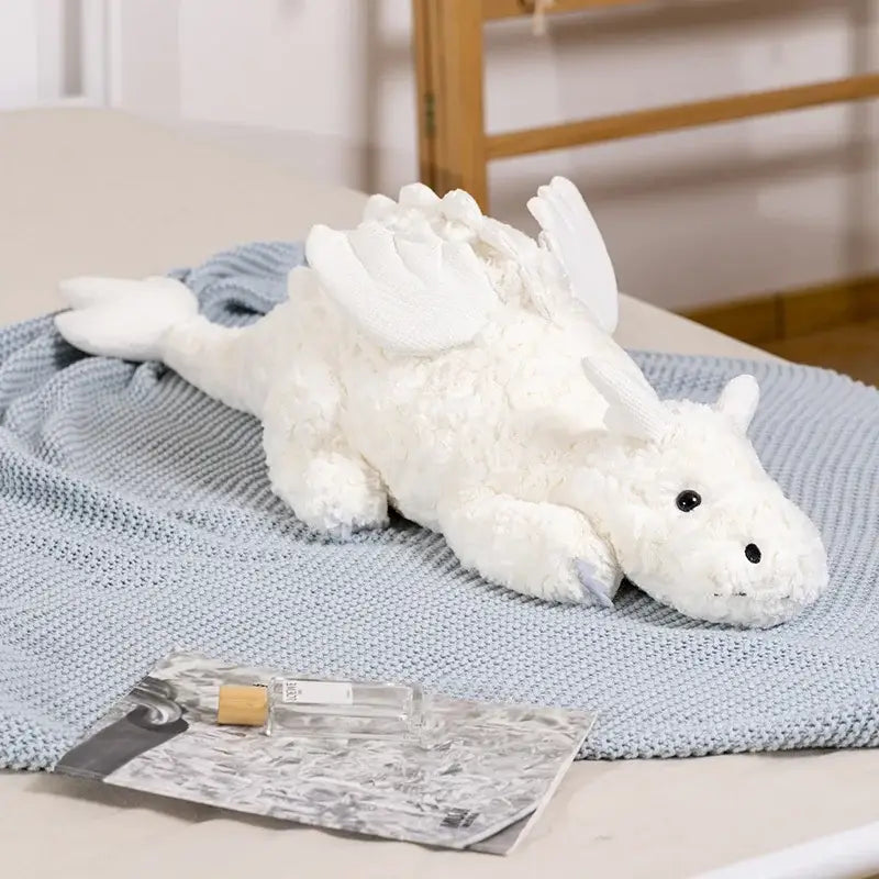 peluche dragon moelleux blanc