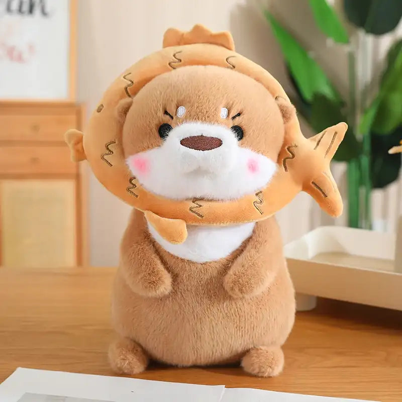 peluche loutre beige poisson