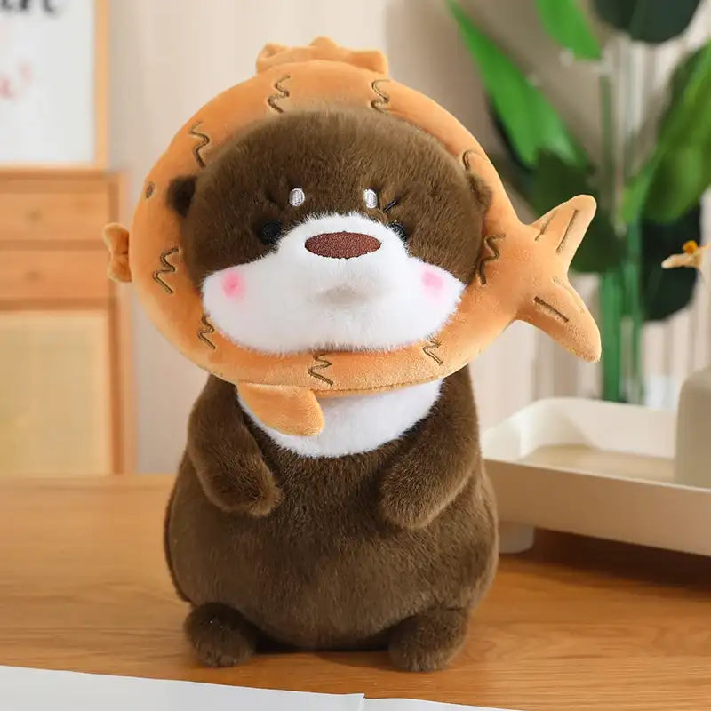 peluche loutre marron poisson