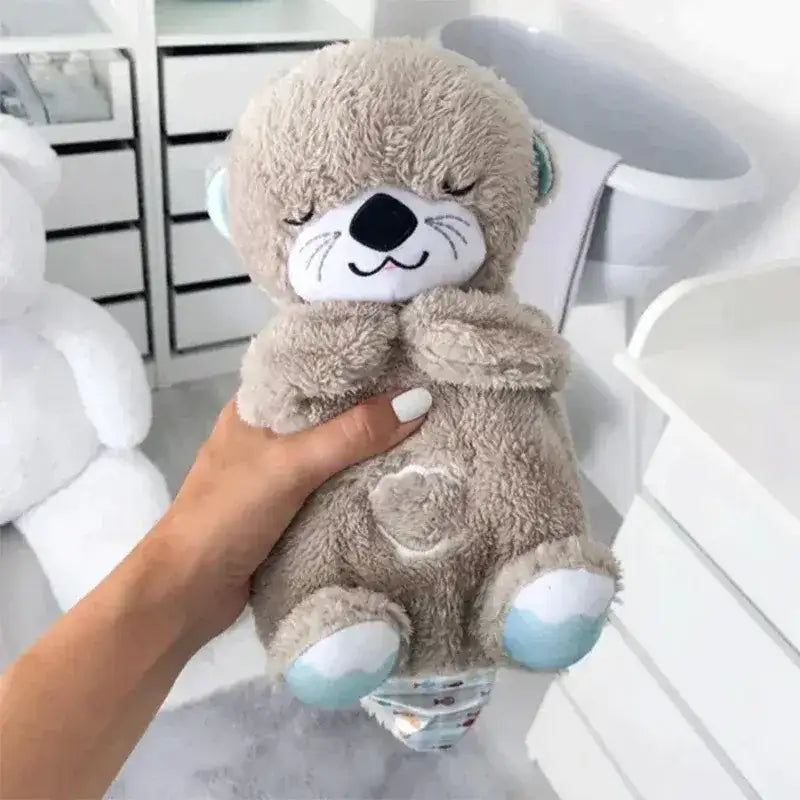 peluche loutre qui respire grise