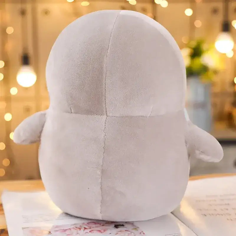 peluche pingouin derriere