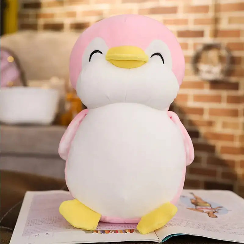 peluche pingouin heureux rose