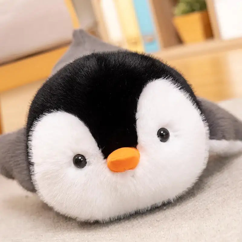 visage peluche pingouin